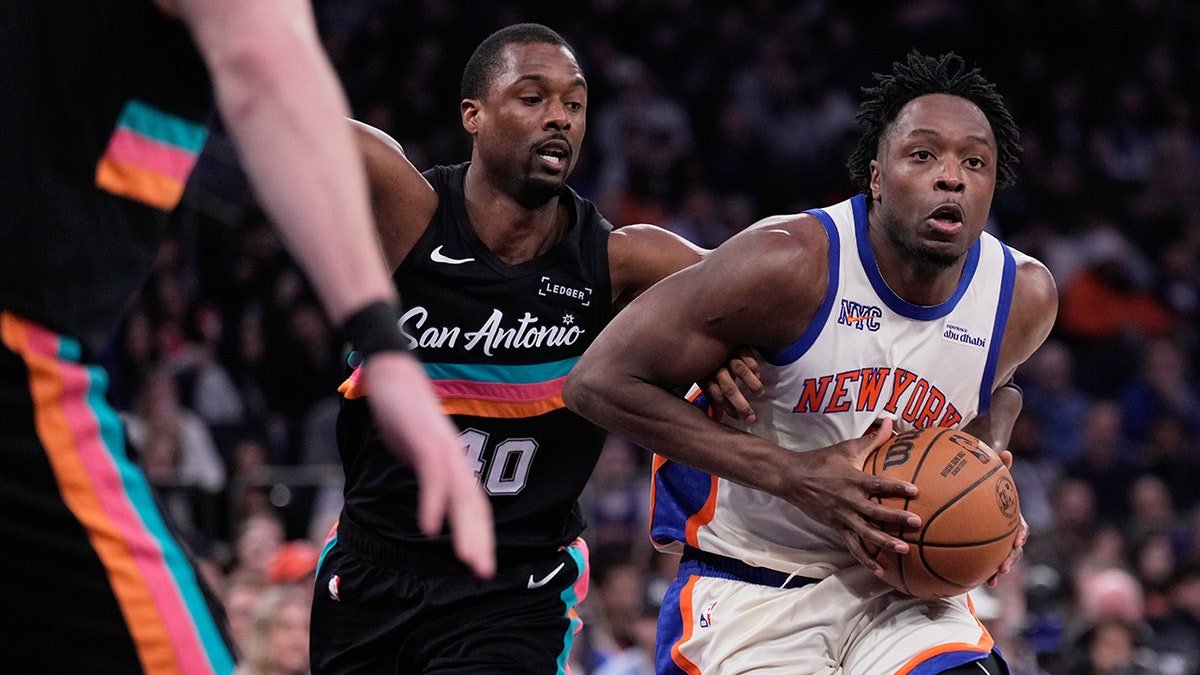 Harrison Barnes tries to defend