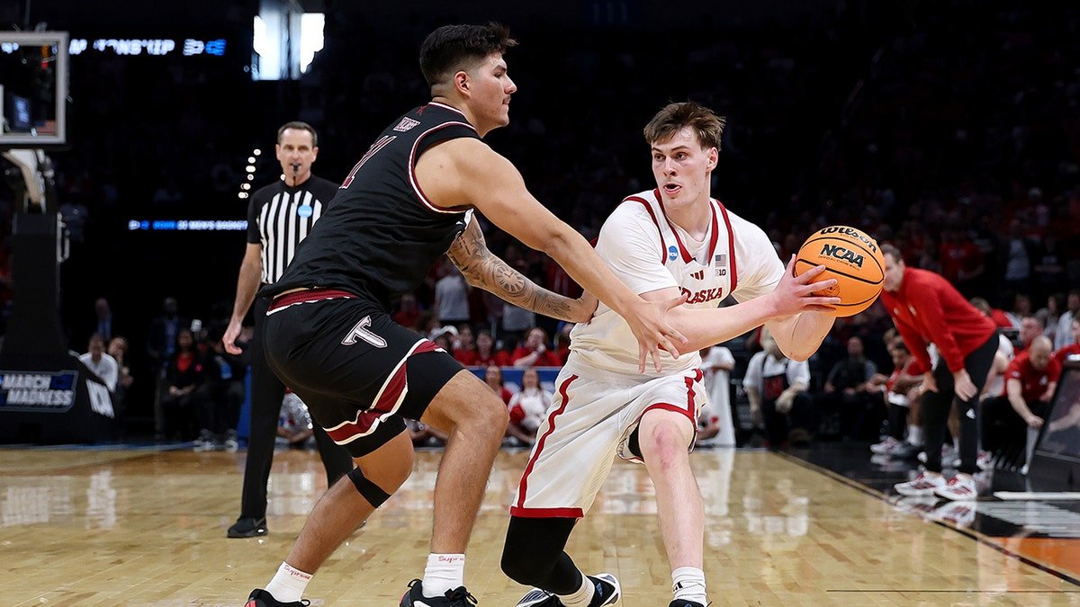 Nebraska player looks to pass vs Troy