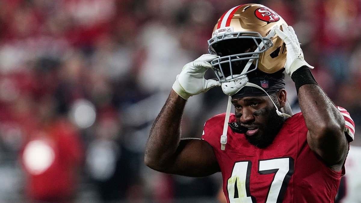 Bryce Huff puts his helmet on