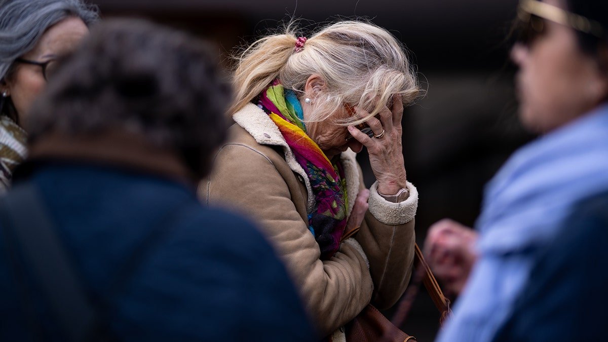 Woman grieves for Noelia Castillo Ramos. 