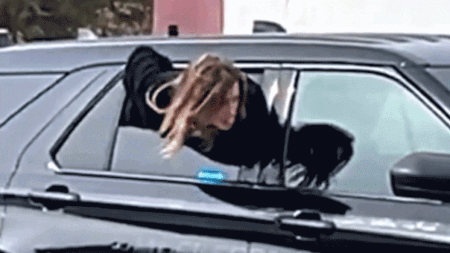 Handcuffed woman who wriggled out of police cruiser window in viral video caught days later