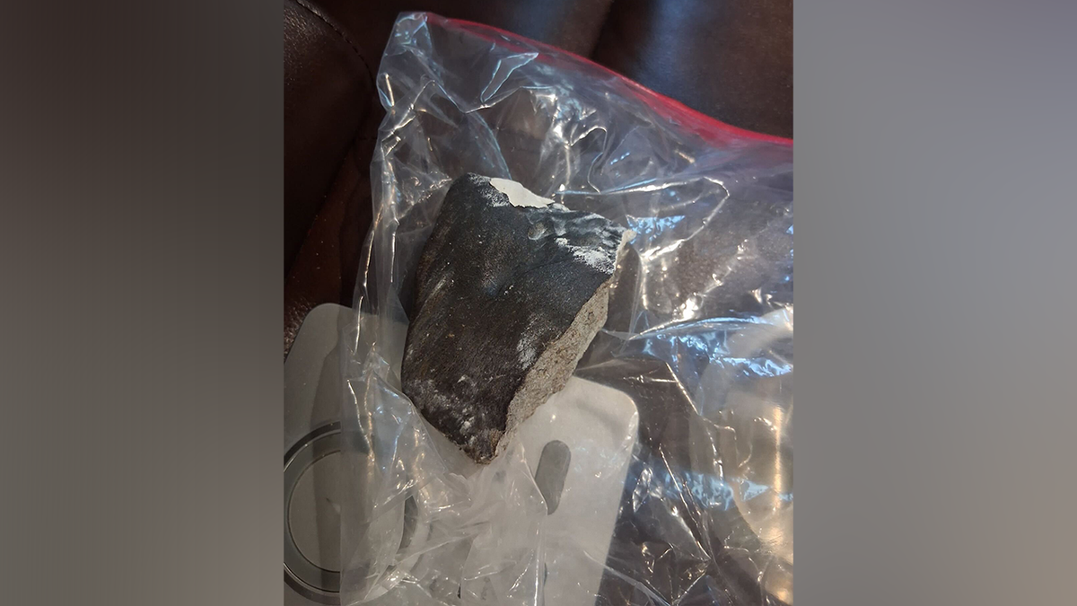 A photo showed what appeared to be a large rock with a black exterior.