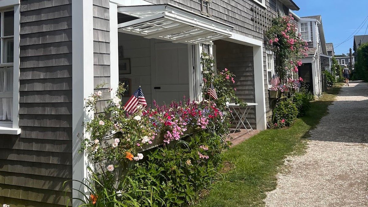 sconset rose cottage on nantucket with American flag