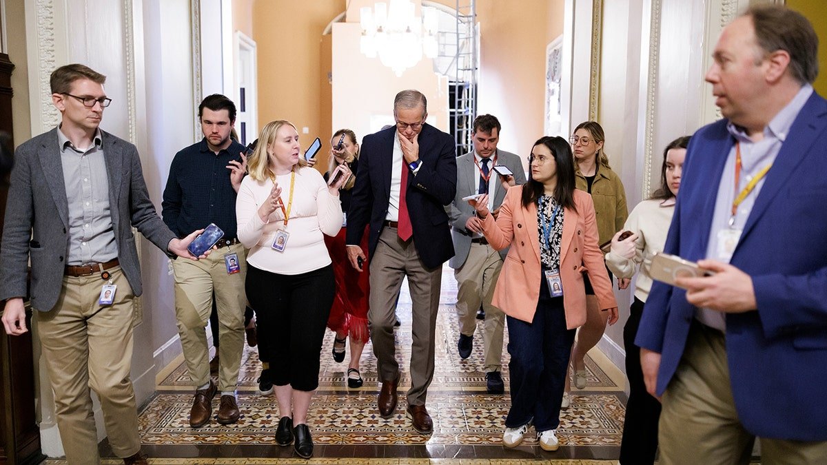 Senate Majority Leader John Thune speaking to reporters in the Ohio Clock Corridor on Capitol Hill.