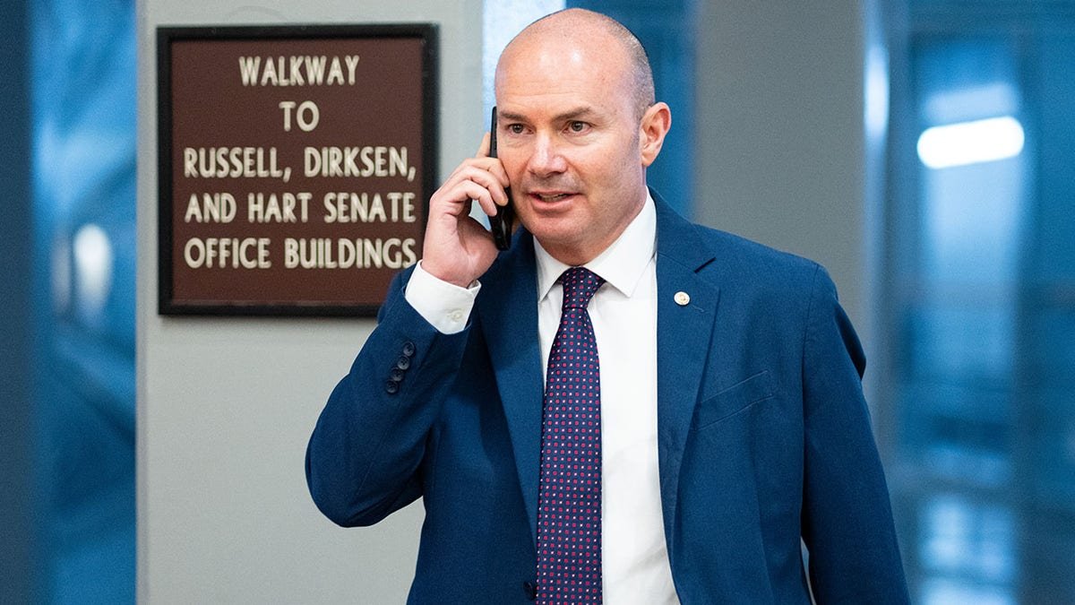 Sen. Mike Lee, R-Utah, walks through the Senate subway.