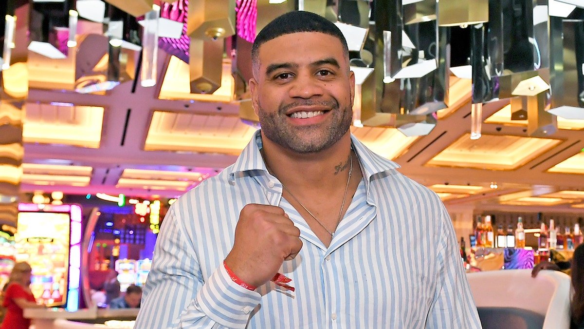 Shawne Merriman poses with fist up