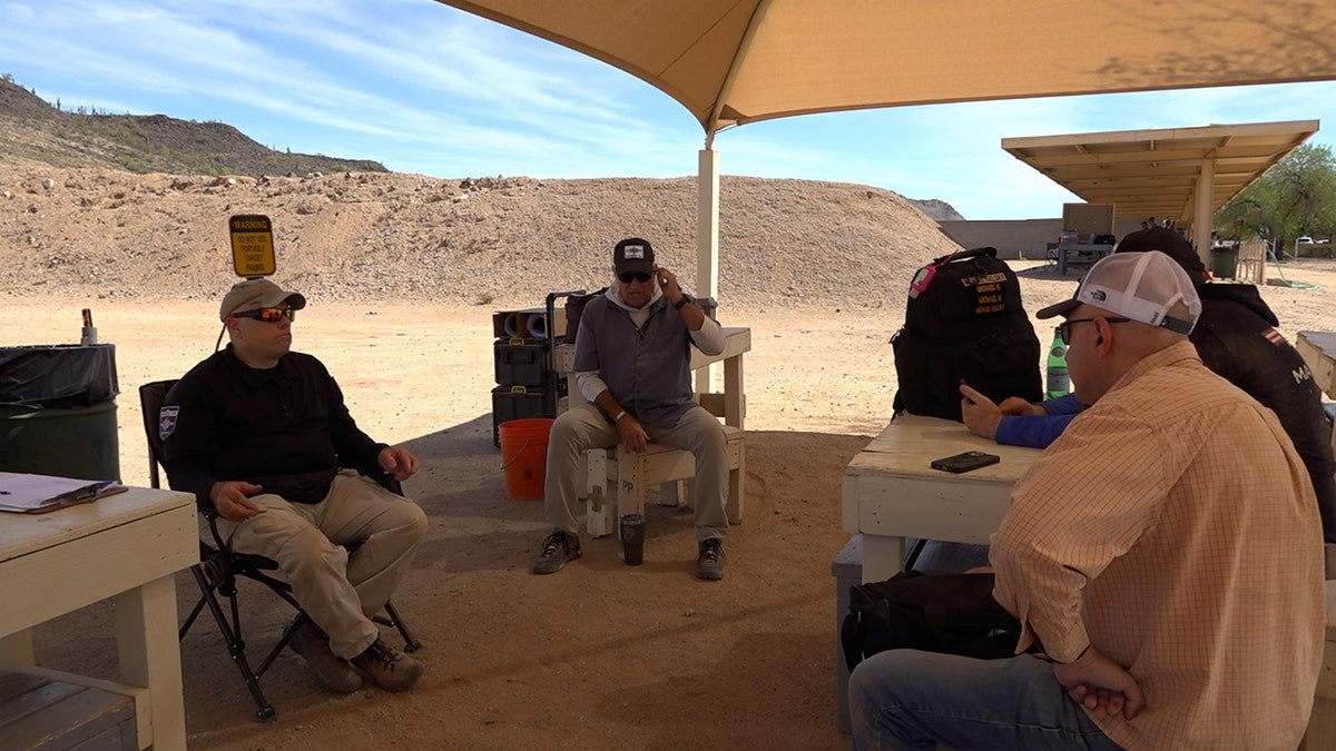Volunteers for Magen Am debrief their training that day.
