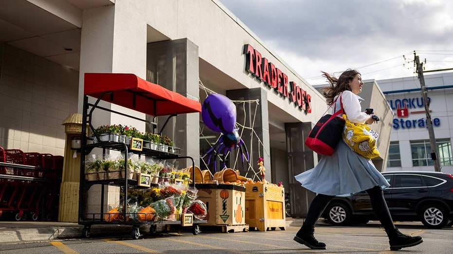 A shopper exits Trader Joe's in the North Center neighborhood of Chicago