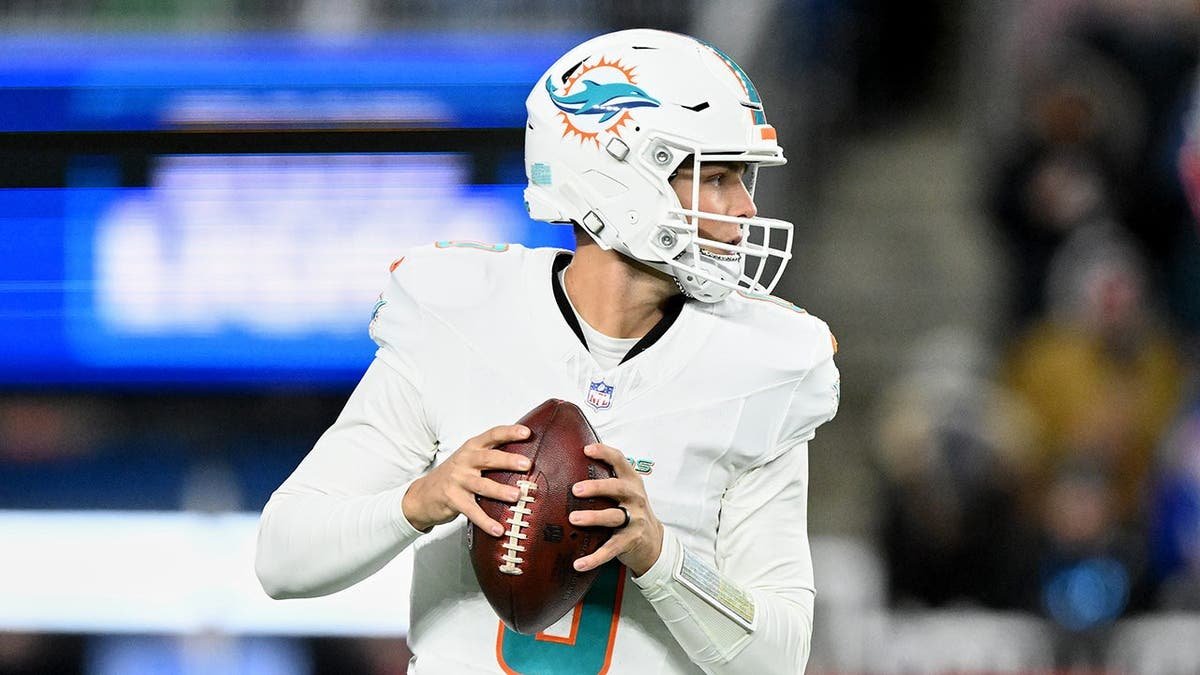Dolphins' Zach Wilson looks to throw