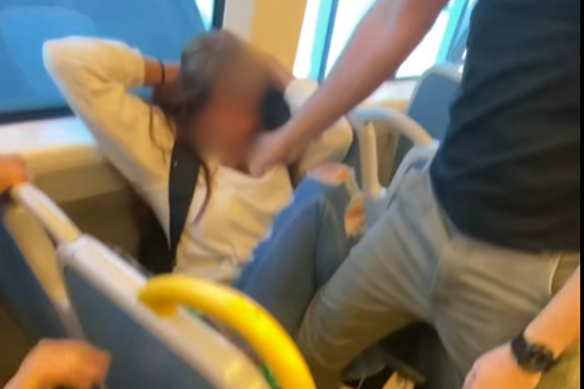 The girl with her head against the window.