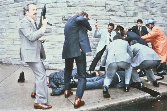 The aftermath of the assassination attempt on president Ronald Reagan in March 1981 in Washington, DC. A press secretary and security service agent are shown injured on the ground.