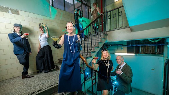 Samantha Schrader (front), Anna Prifti (right) and Stephen McLaughlan (far right) and other tenants hold a 1920s-style party to celebrate the centenary of the Nicholas Building.