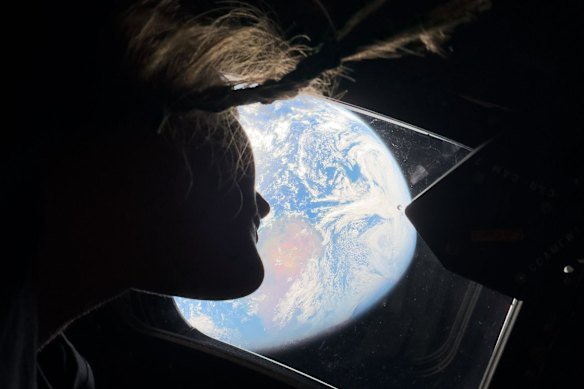 The view from the spacecraft’s main cabin windows, looking back at Earth.