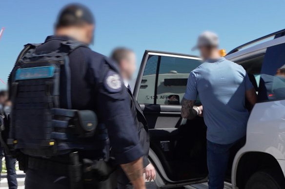 Ben Roberts-Smith was taken away by an AFP car waiting on the tarmac after his arrival from Brisbane.