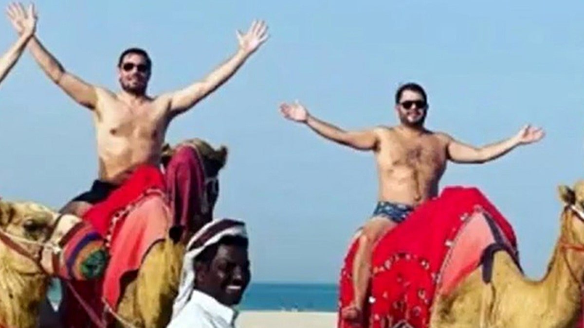 Democrats Eric Swalwell and Ruben Gallego seen riding camels shirtless during expense-paid trip to Qatar in 2021.