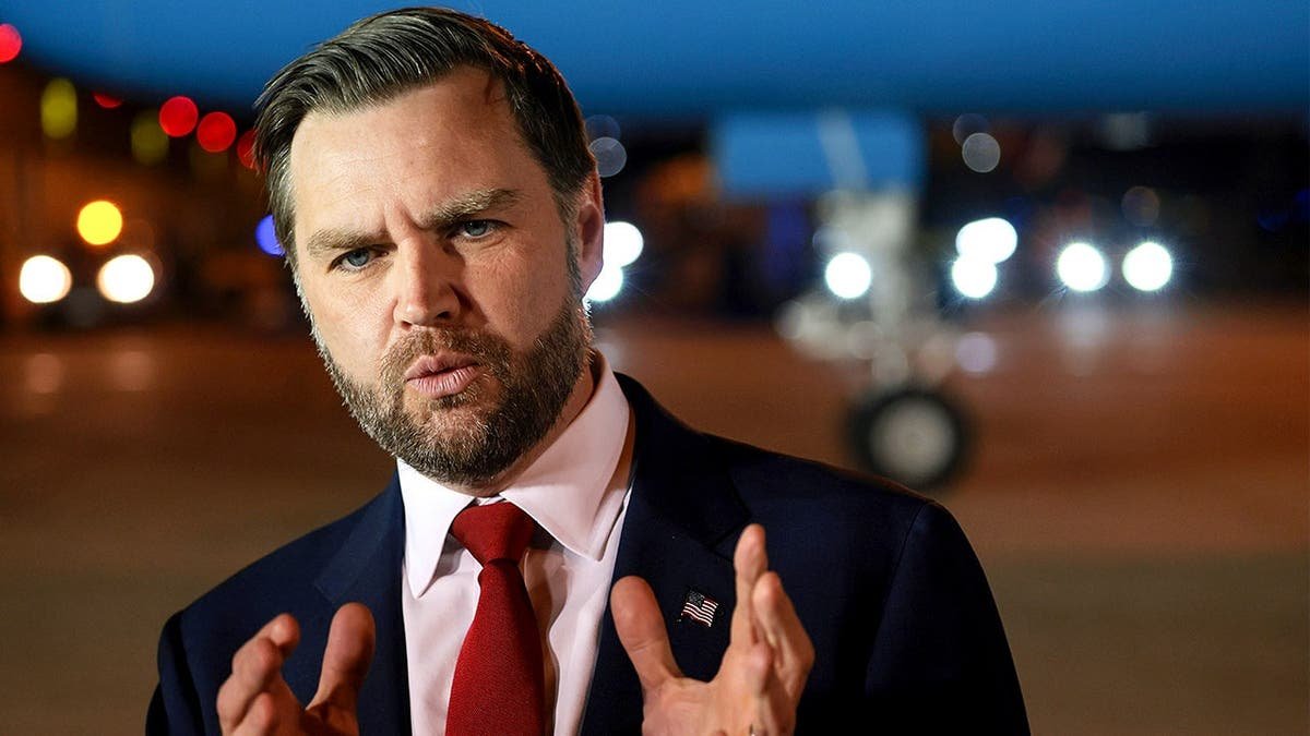 Vice President JD Vance speaks to reporters before boarding Air Force Two.
