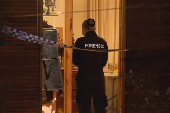 A police forensic officer at the house after the shooting.
