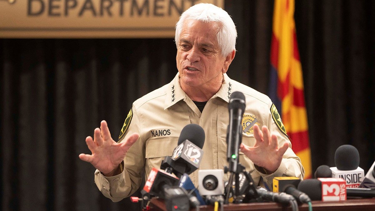 Pima County Sheriff Chris Nanos speaking at a podium during a press conference