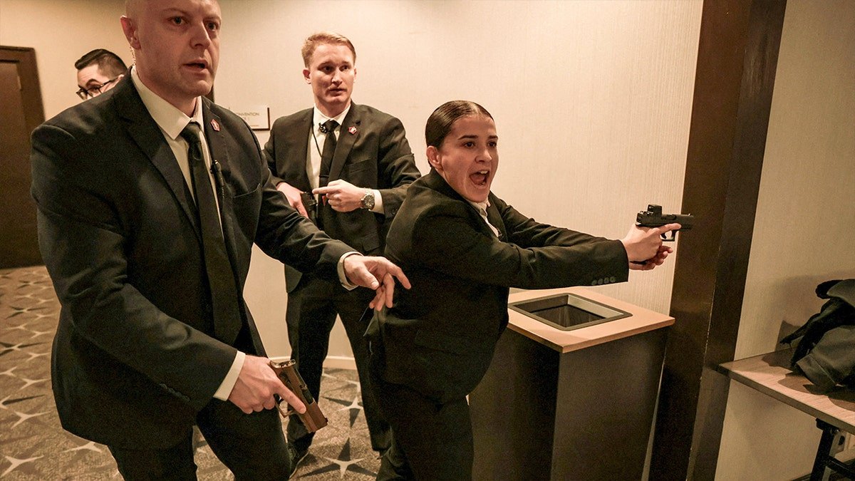 Security officials react as a shooter opens fire during the annual White House Correspondents' Association dinner in Washington, D.C., U.S., April 25, 2026.