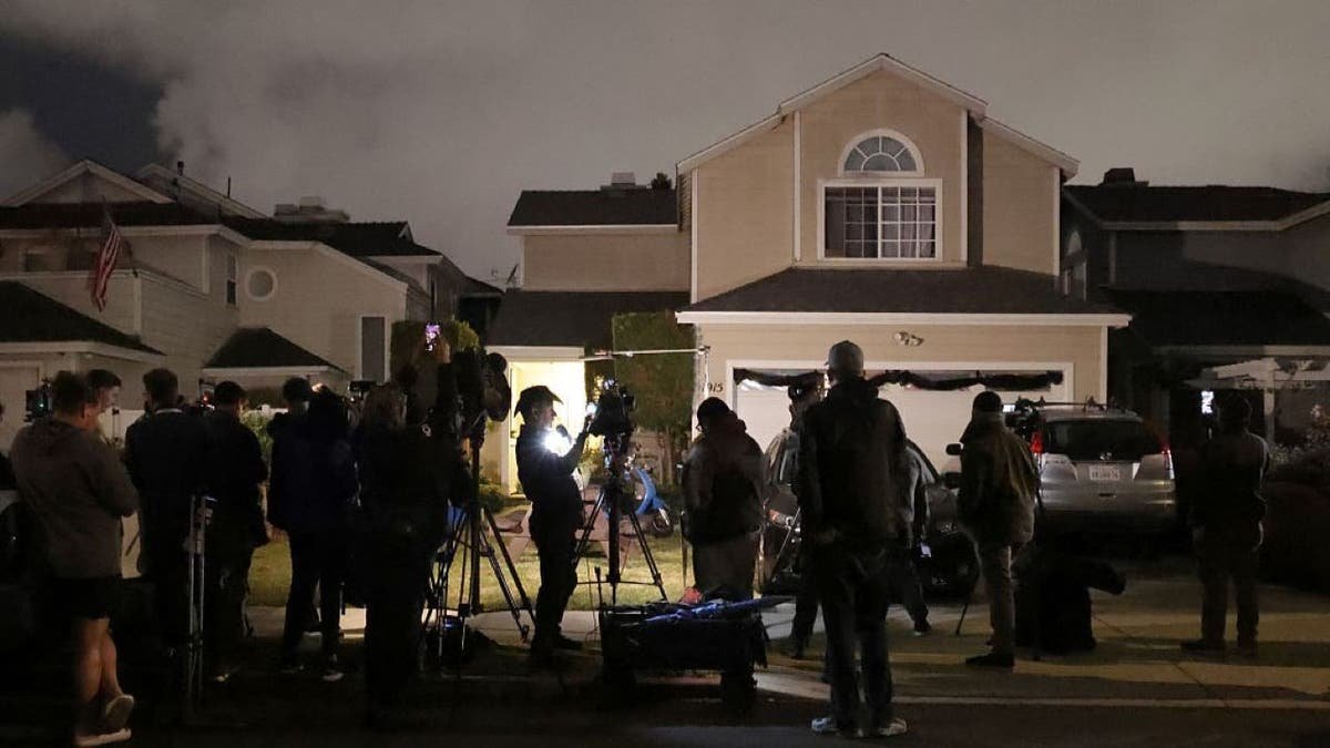 Media and onlookers gathered in front of a house connected to Cole Tomas Allen in Torrance, California