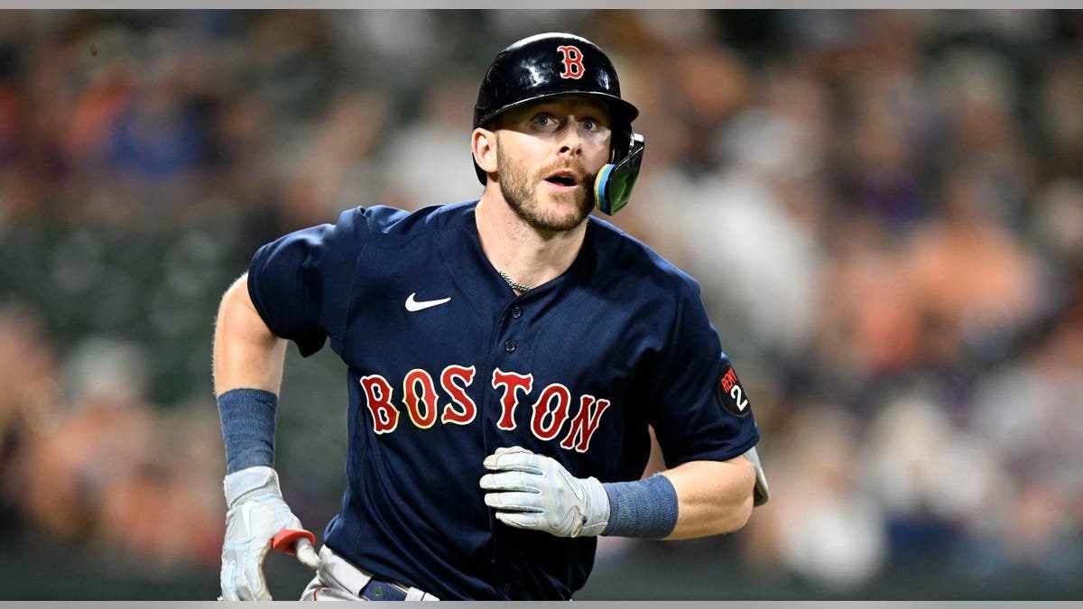 Trevor Story running to first base at Oriole Park at Camden Yards