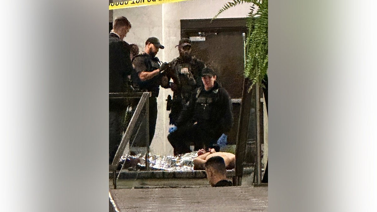 Cole Tomas Allen being restrained by law enforcement officers at the White House Correspondents Dinner
