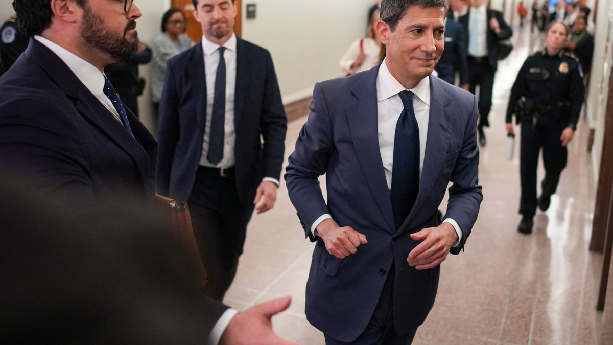 Kevin Warsh departs the Senate Committee on Banking, Housing, and Urban Affairs confirmation hearing in the Dirksen Senate Office Building on April 21, 2026.