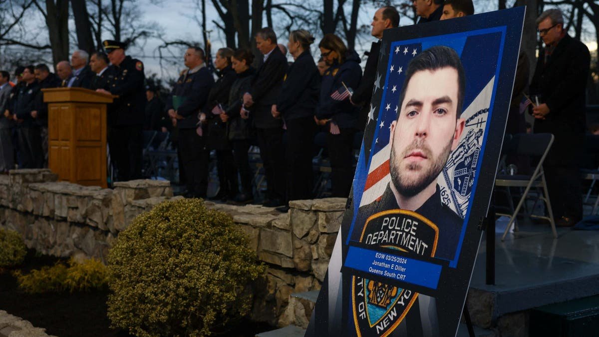 Portrait of late NYPD Officer Jonathan Diller displayed at candlelight vigil in Massapequa