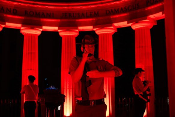 The catafalque party stands guard at the cenotaph during Saturday’s dawn service at Anzac Square in Brisbane.