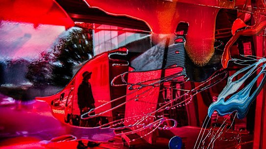 Artist Matthew Cook reflected in the work of Sulman prize entry by Vicki Lee.