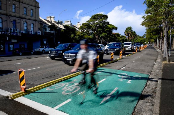 The pop-up cycleway on Moore Park Road remains in place six years after it was installed as a temporary transport measure.