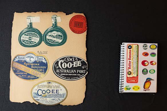 Collections of labels from early wine labels and fruit stickers in a book. 