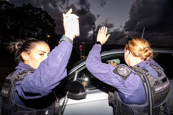 Corrective Services NSW officers attempt to stop this masthead from photographing Roberts-Smith.