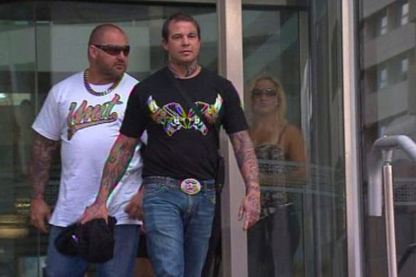 Murder accused man David Pye walking out of court in 2013 in front of his former ally and alleged victim, Nick Martin.
