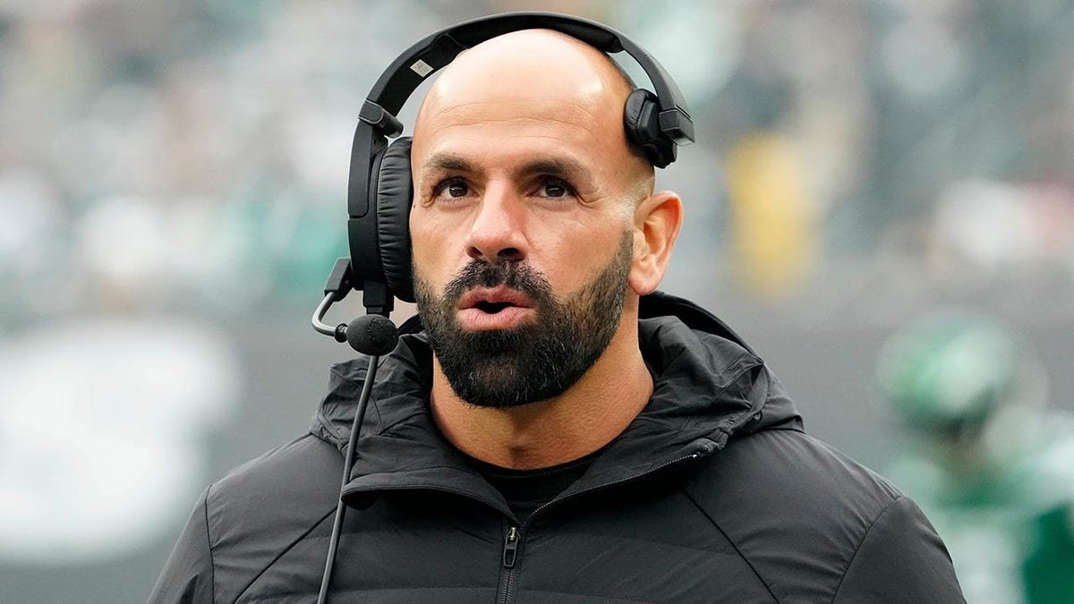 New York Jets head coach Robert Saleh standing on the sideline at MetLife Stadium