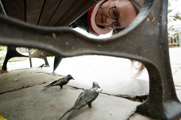Public art curator Barbara Flynn looks down on one of more than 60 handcrafted bronze birds made by artist Tracey Emin. The work starts at Macquarie Place Park in the city.