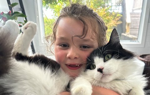 Charlie cuddles the ever-compliant Sparkles.