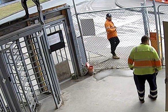 Richie Atutulo (orange shirt) pacing outside after threatening to fight someone.