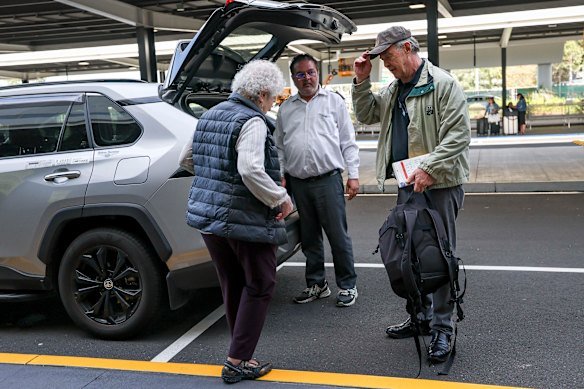Travellers Karen Senter and David Macenulty gave up trying to use the taxi prepaid kiosk after several attempts. 