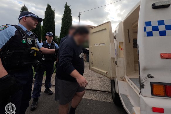 Elic Tang is taken into custody.