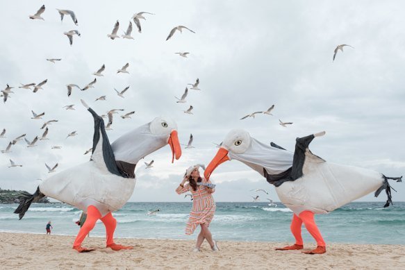 Then-Sydney Festival director Olivia Ansell at Bondi Beach in 2024 with Snuff Puppets’ giant seagulls.