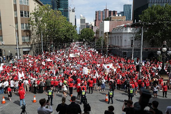 Teachers and staff from Victorian state schools rally outside parliament on March 24.