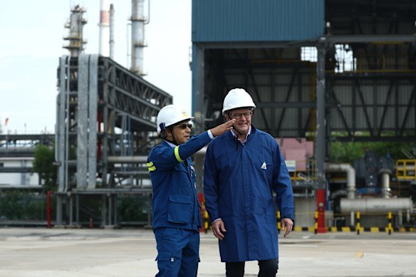 Prime Minister Anthony Albanese with Singapore Refining Company  chief Eso Thomas on a tour of Jurong Island on Friday.