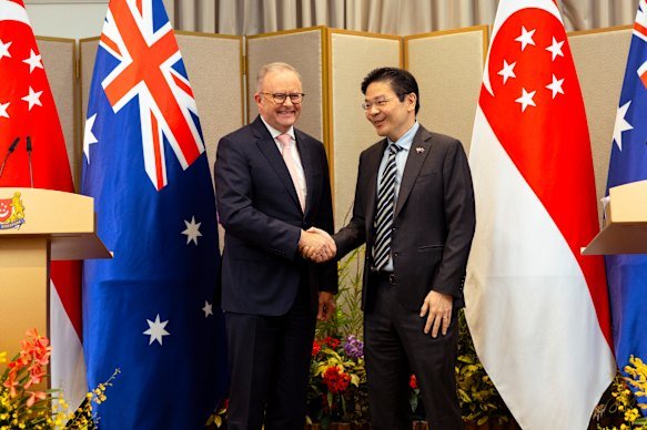 Shake on it: Australian Prime Minister Anthony Albanese with his Singaporean counterpart Lawrence Wong. 