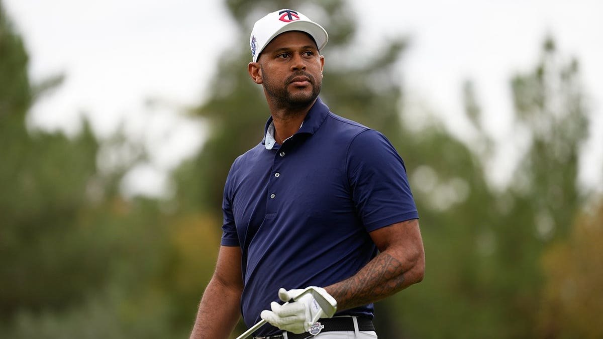 Aaron Hicks looks on after teeing off at Shadow Creek Golf Course