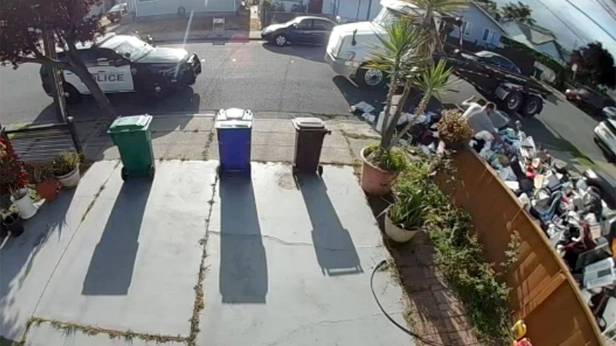 Police arrive after trash dumped on front lawn in California
