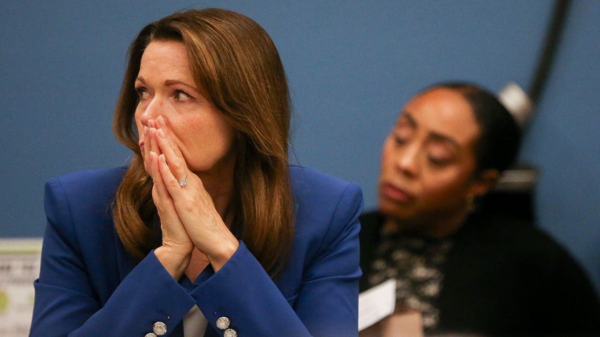 Christina Bohannan listening during a roundtable discussion.