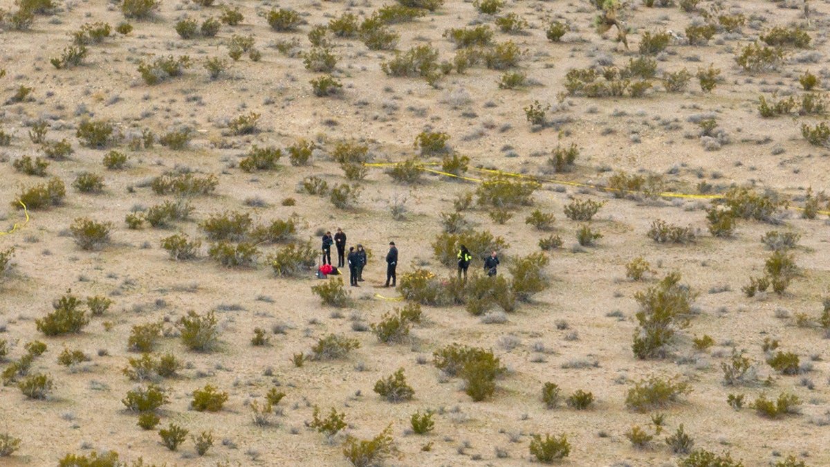 San Bernardino sheriff's department officials investigating a remote outdoor scene