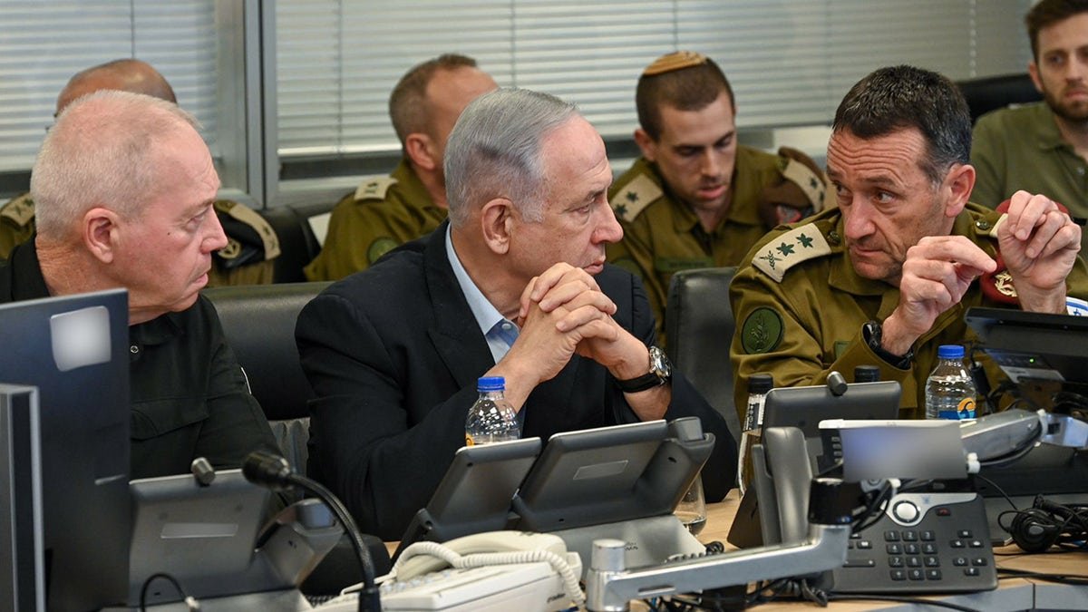 Israeli Prime Minister Benjamin Netanyahu and Defense Minister Yoav Gallant watch a military operations center in Jerusalem