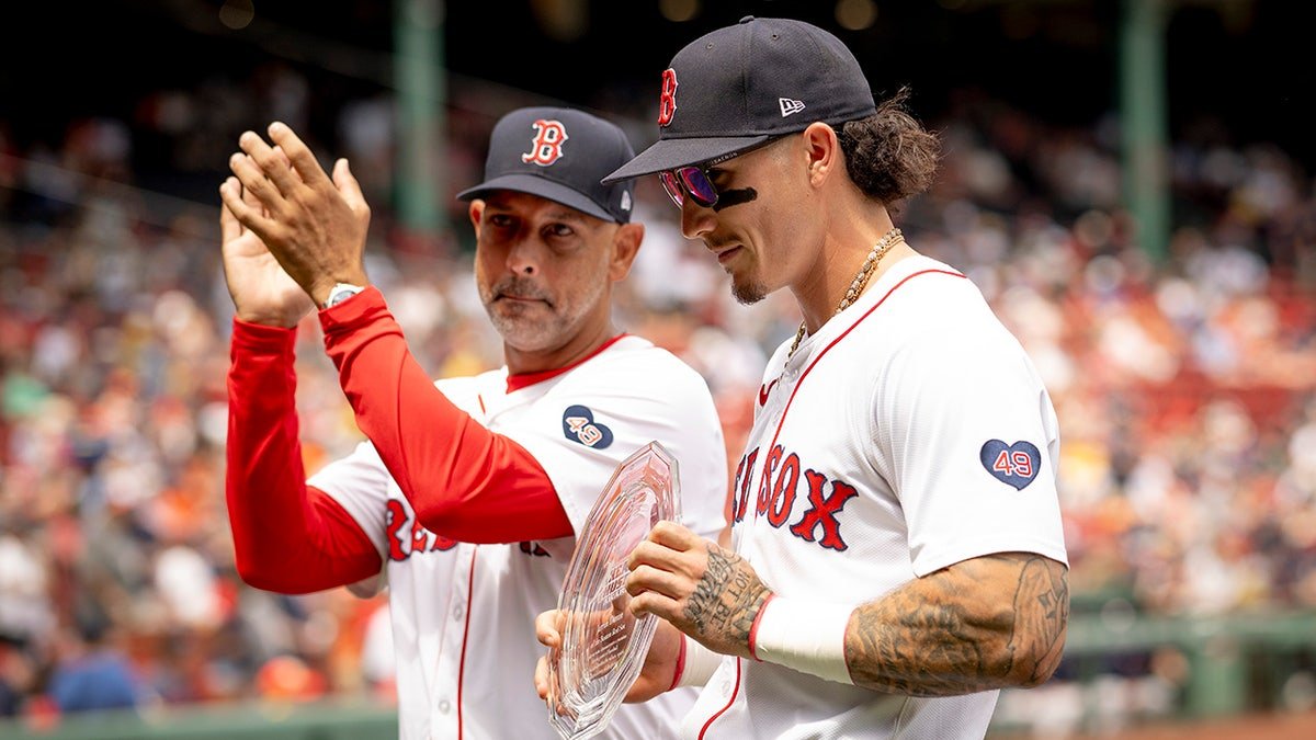 Manager Alex Cora and Jarren Duran of the Boston Red Sox during award presentation at Fenway Park